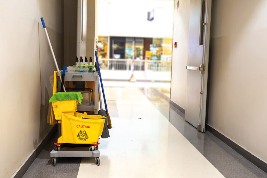 Cleaning tools cart wait for maid or cleaner in the department store. Bucket and set of cleaning equipment in the mall. Concept of service, worker and equipment for cleaner and health