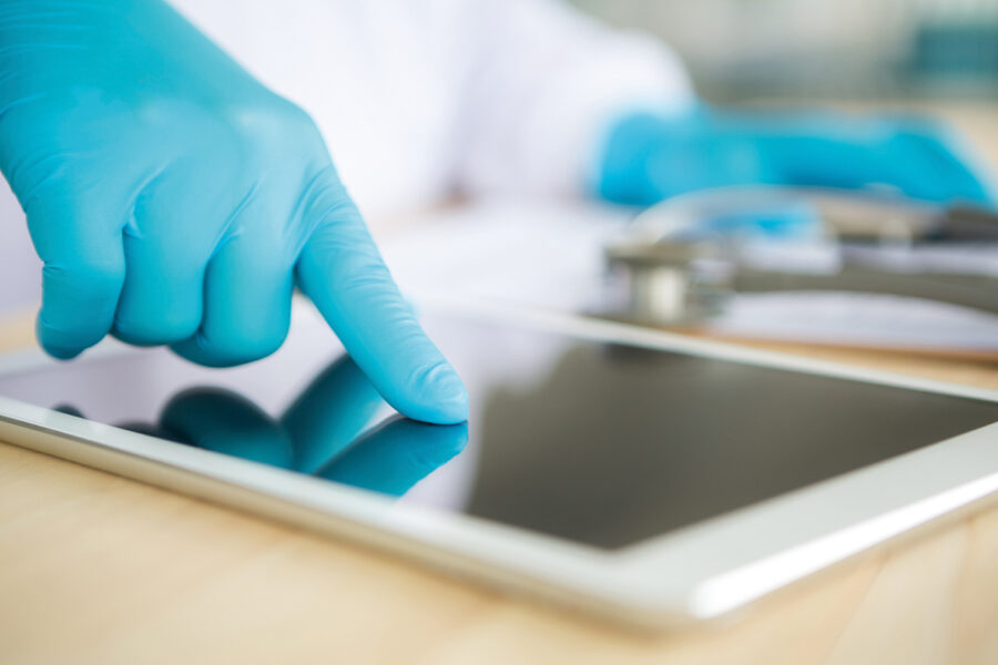 Doctor using tablet computer